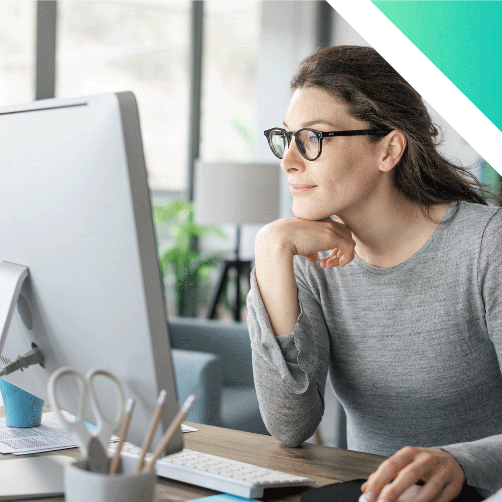 professional woman working on desktop computer